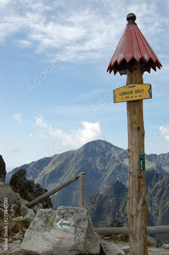  Wooden signpost on a path in the High Tatras Mountains in a summer, Slovakia.