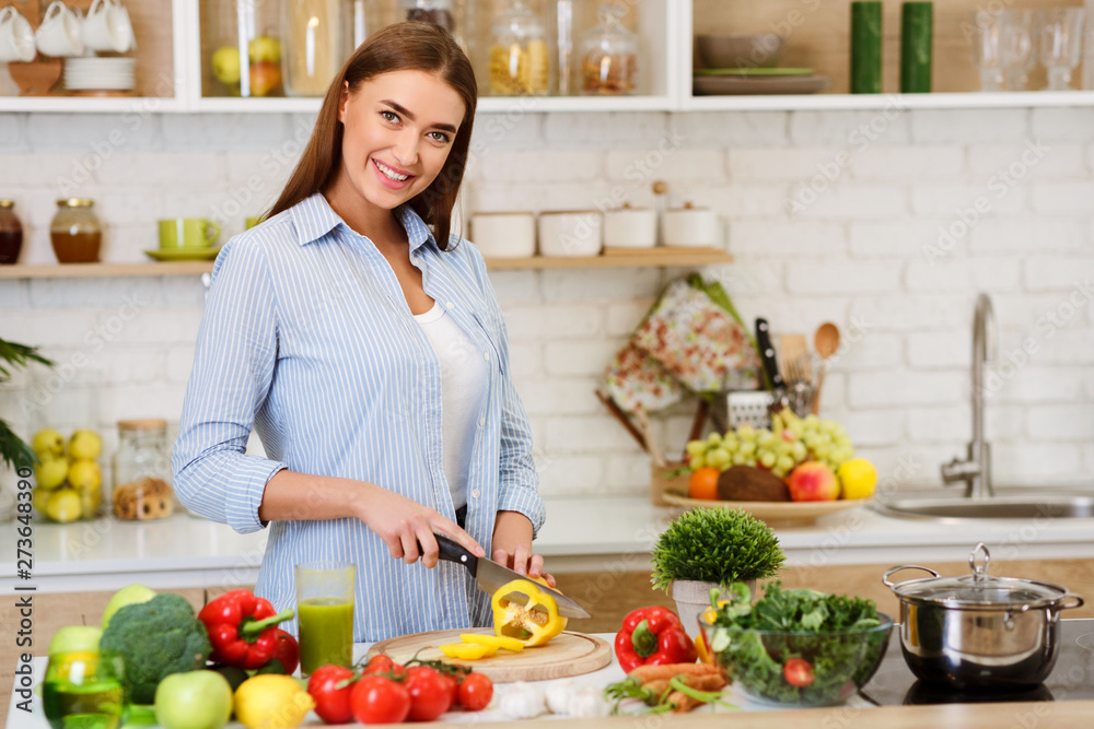Cooking Vegetable Salad. Happy Woman Cutting Pepper Cooking Vegetable Salad. Happy Woman Cutting Pepper