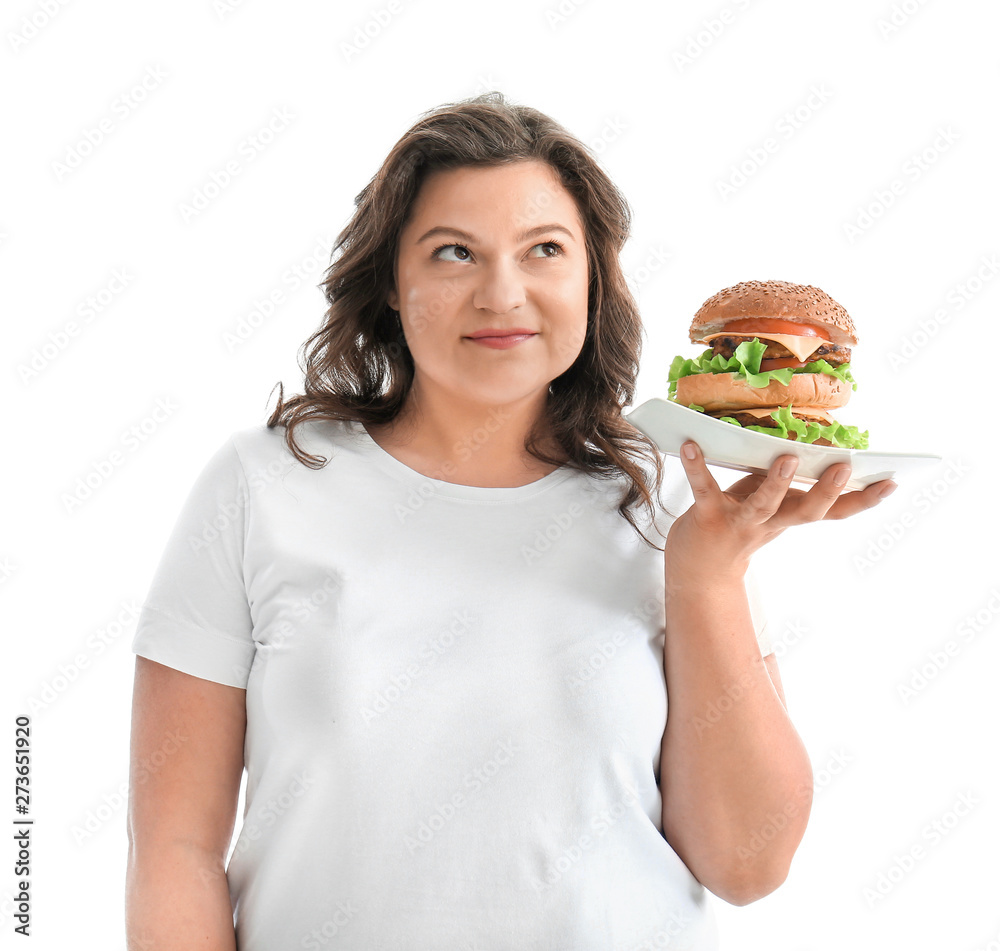 Plus size woman with tasty burger on white background. Concept of body positive Plus size woman with tasty burger on white background. Concept of body positive