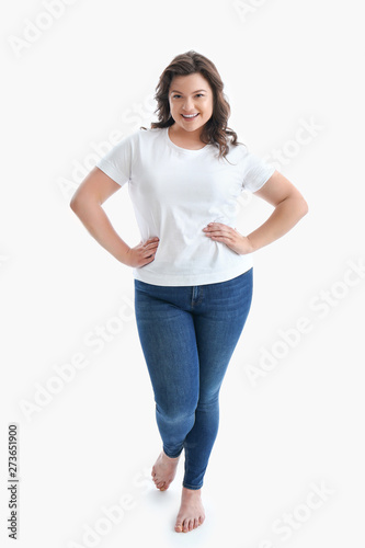 Plus size woman on white ba...