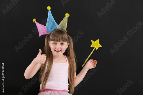 Cute little girl near dark ...