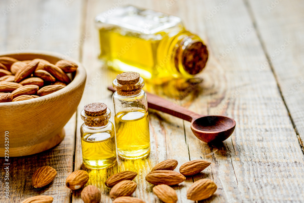 organic cosmetic with almond extract on table background organic cosmetic with almond extract on table background