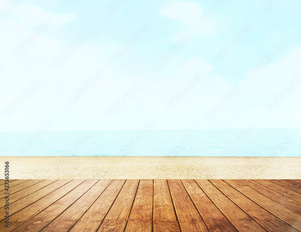 Table top with beach background, sky and cloud in sunny day for product display job showing. Wooden table for display or montage your products. Table top with beach background, sky and cloud in sunny day for product display job showing. Wooden table for display or montage your products.