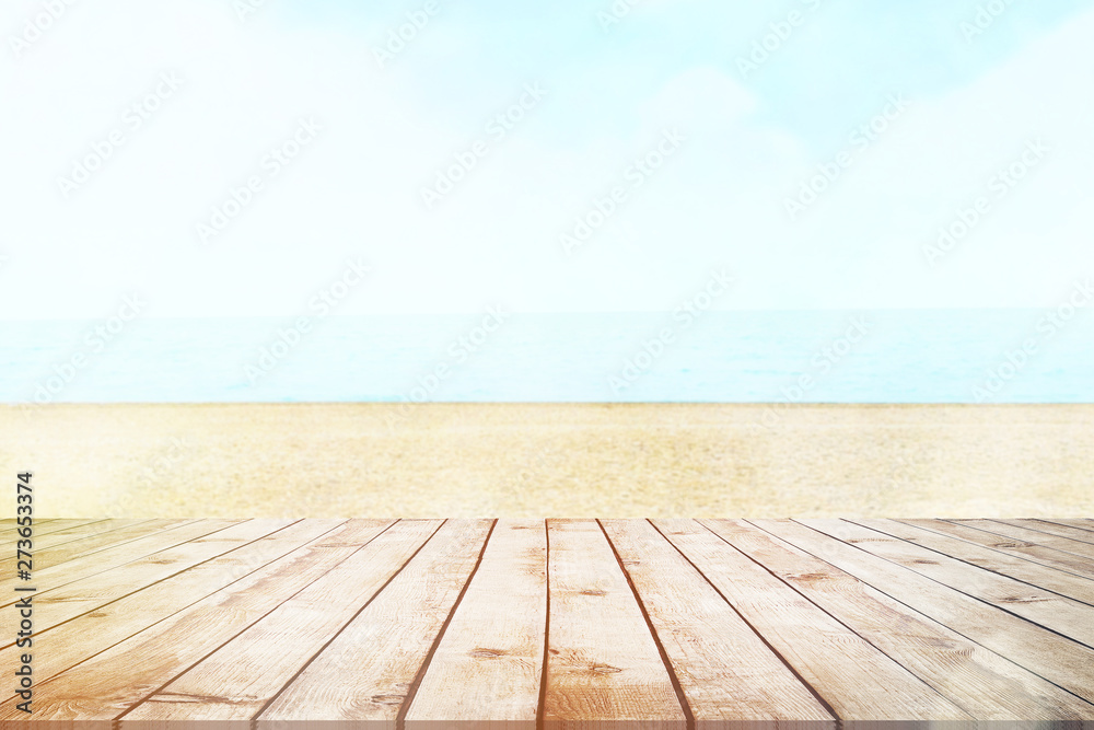 Wood table top on blur sea background. Summer, nature concepts. For montage product display or design key visual layout. Wood table top on blur sea background. Summer, nature concepts. For montage product display or design key visual layout.