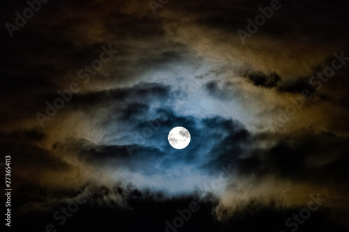 Dramatic night sky with full moon over United Kingdom