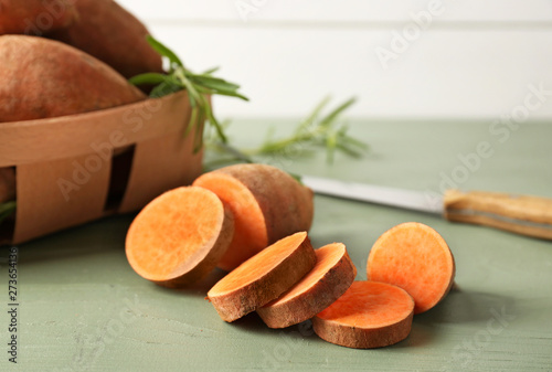 Raw cut sweet potato on table
