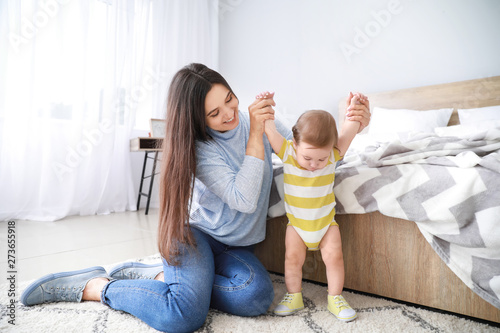 Happy mother with adorable ...