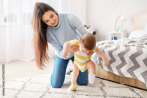 Happy mother with adorable ...