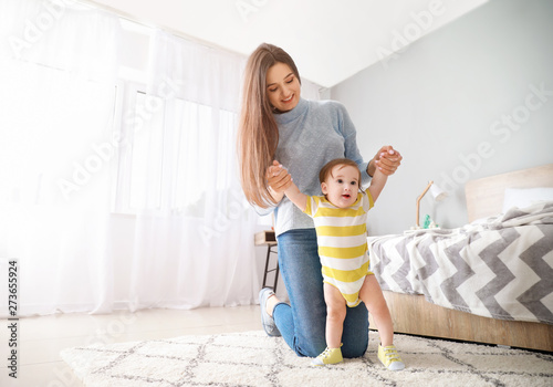 Happy mother with adorable ...