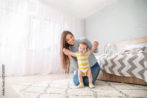 Happy mother with adorable ...