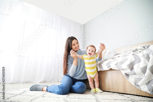 Happy mother with adorable ...