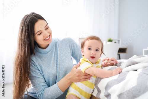 Happy mother with adorable ...