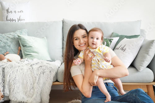 Happy mother with adorable ...