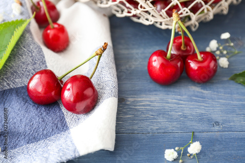 Sweet ripe cherry on wooden background