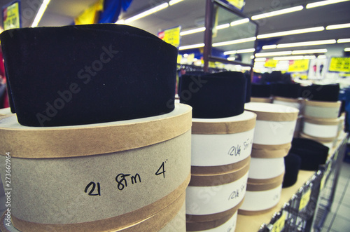 selective focus shot, black color stacking songkok hat for muslim in the store photo