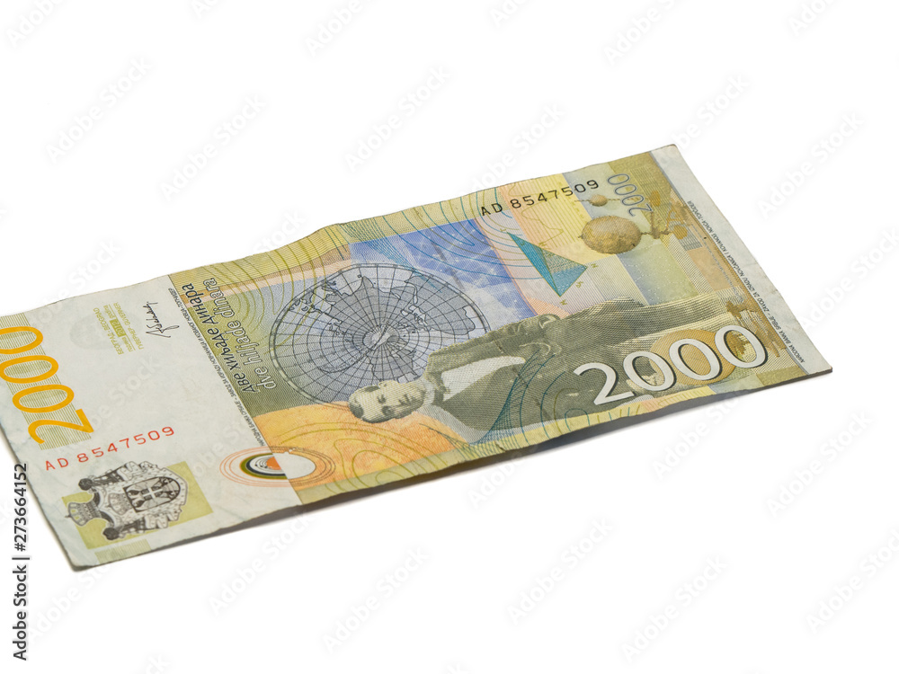 One banknote worth 2000 Serbian Dinars with a portrait of a climate scientist Milutin Milankovic isolated on a white background One banknote worth 2000 Serbian Dinars with a portrait of a climate scientist Milutin Milankovic isolated on a white background