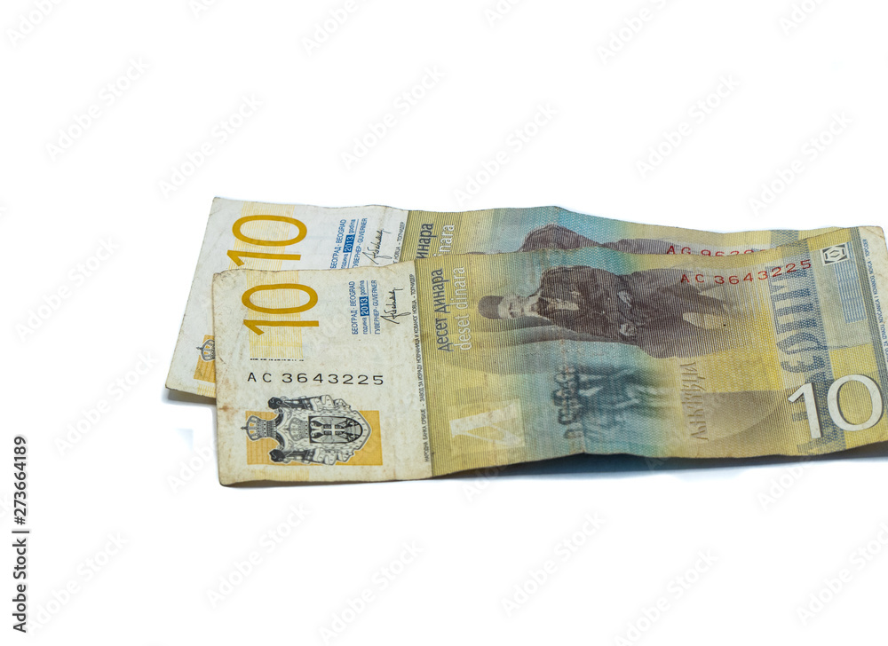 Two banknotes worth 10 Serbian Dinars with a portrait of a Linguist Vuk Karadzic isolated on a white background Two banknotes worth 10 Serbian Dinars with a portrait of a Linguist Vuk Karadzic isolated on a white background