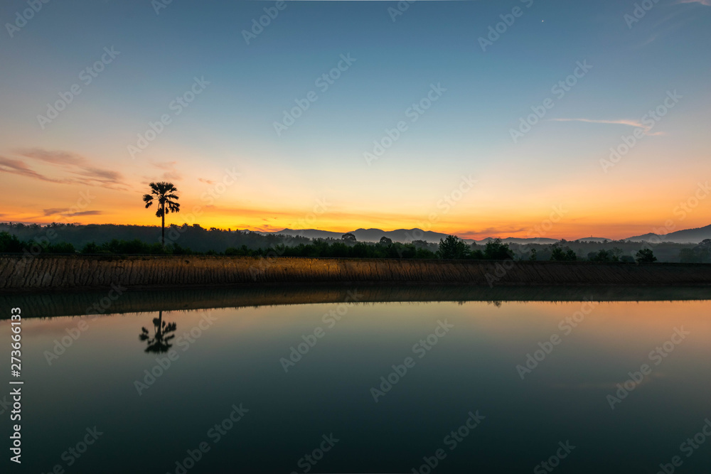 View at Ban Thong Suk Reservoir, Songkhla, Thailand at sunrise. View at Ban Thong Suk Reservoir, Songkhla, Thailand at sunrise.