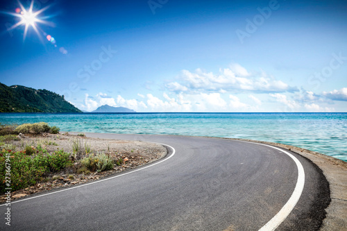 Summer road background of free space for your decoration and ocean landscape. 