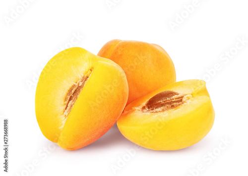 Ripe juicy apricots on a white background