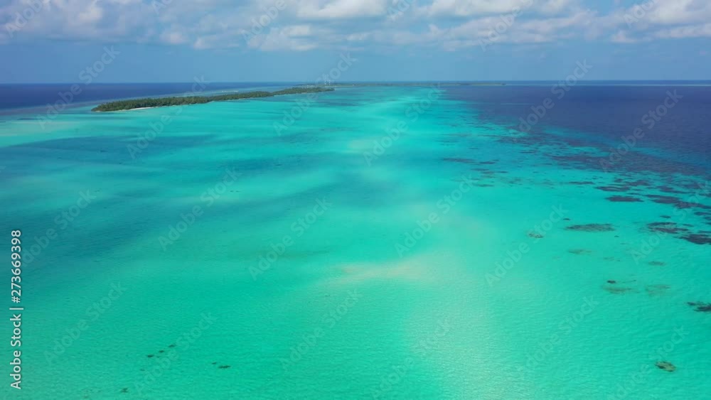 Philippines: aerial view of the clear turquoise waters outside of a small island with no sign of boats or human activities Philippines: aerial view of the clear turquoise waters outside of a small island with no sign of boats or human activities