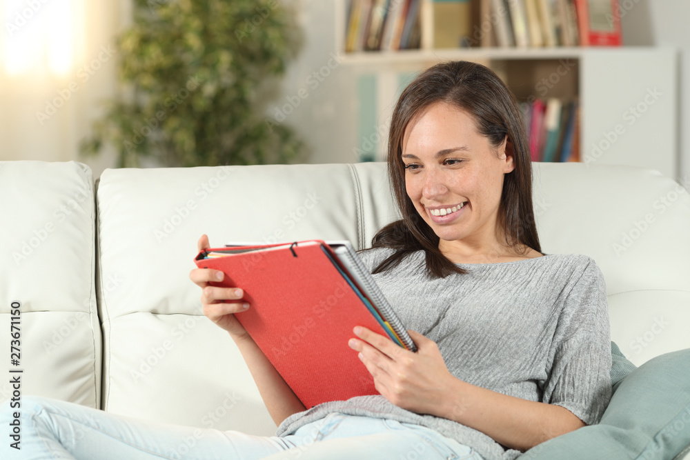 Happy adult student learning reading notes at home Happy adult student learning reading notes at home