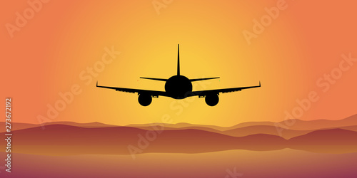 The plane flies at sunset, clear sky. opening of the flight season