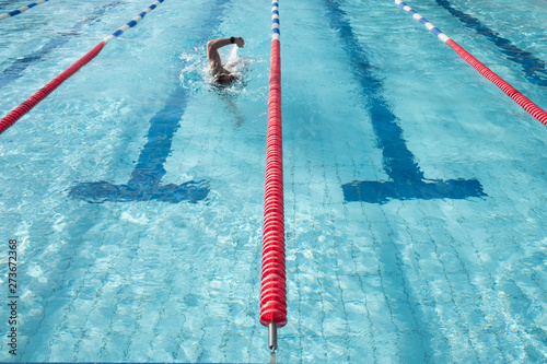Tableau sur toile A swimmer talking an early morning open air swim