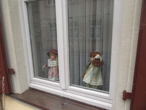 Doll toys in the window photo