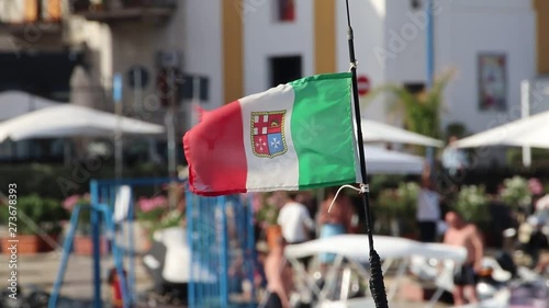 Bandiera italina con i simboli delle  antiche repubbliche marinare che si muove al  vento photo