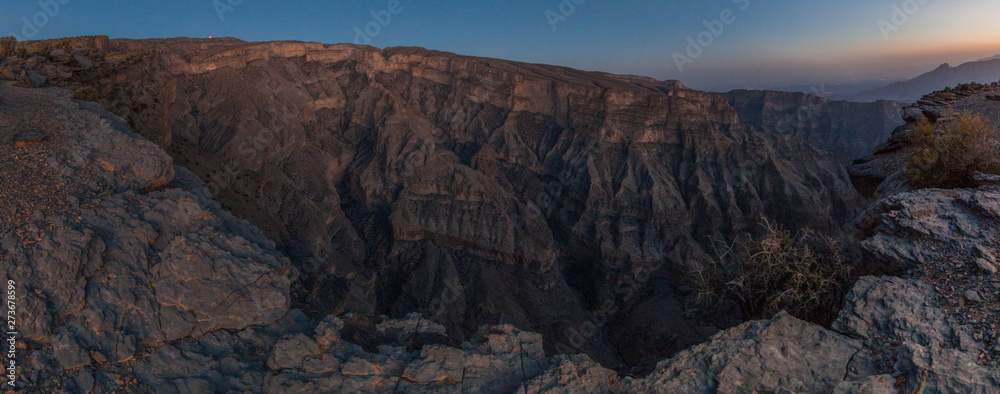 Sunset at Wadi Ghul canyon in Hajar Mountains, Oman