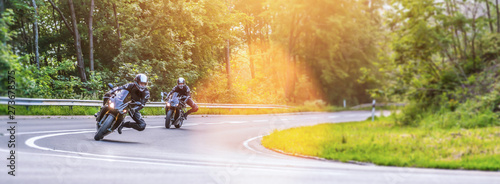 motorbike on the road riding. having fun riding the empty road on a motorcycle tour / journey