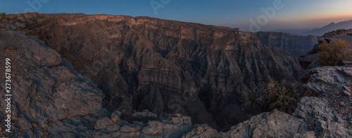Sunset at Wadi Ghul canyon in Hajar Mountains  Oman