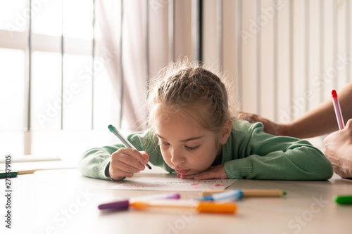 Serious girl coloring picture