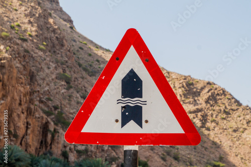 Ford warning on a road through Wadi Tiwi, Oman photo