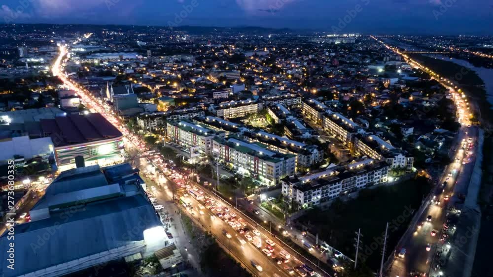 Aerial drone nightlapse shot of the Pasig, Metro Manila bridge during rush hour