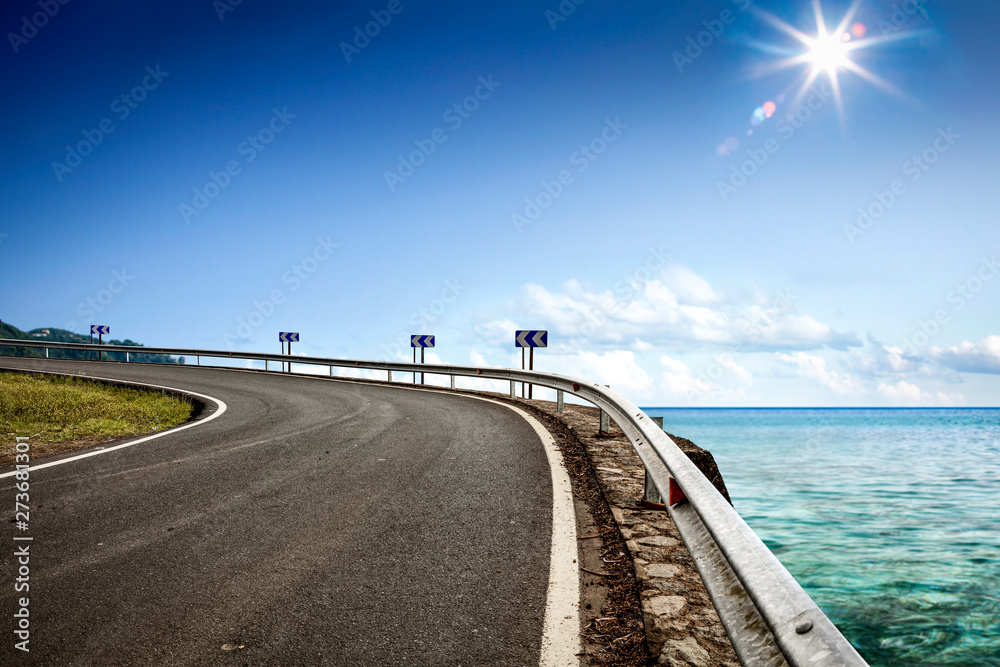 Summer road background of free space for your decoration and ocean landscape. 