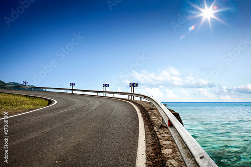Summer road background of free space for your decoration and ocean landscape.  © magdal3na