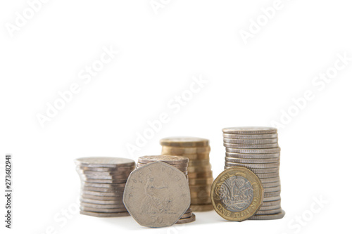 From the side British coins on a white background