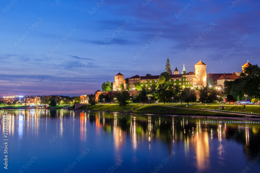 .View of the Wawel Castle from the water in the evening.