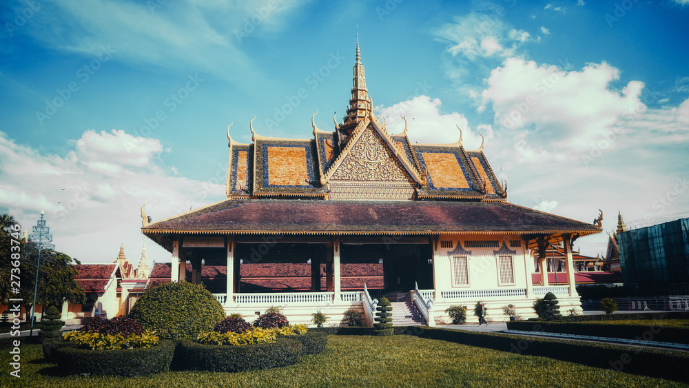 The stunning Royal Palace architecture with a beautiful clear and dynamic blue sky, located at the city of Phnom Penh, Cambodia. The stunning Royal Palace architecture with a beautiful clear and dynamic blue sky, located at the city of Phnom Penh, Cambodia.