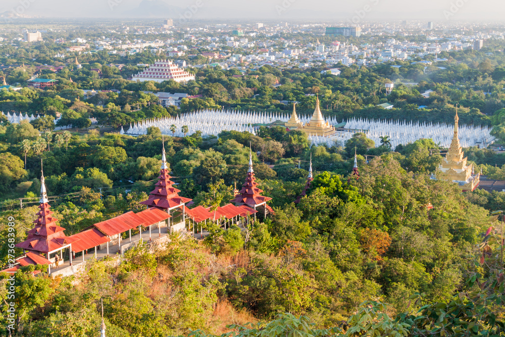 Aerial view of the city from the Mandalay hill, Myanmar. Sandamuni Pagoda and Atumashi Monastery visible.