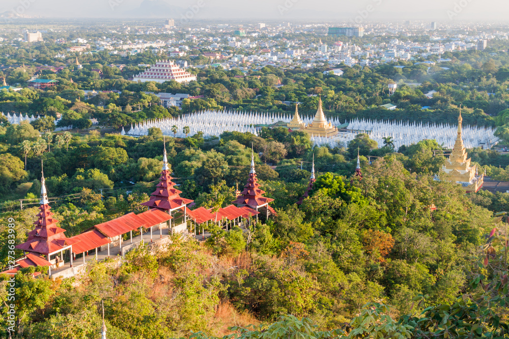 Aerial view of the city from the Mandalay hill, Myanmar. Sandamuni Pagoda and Atumashi Monastery visible. Aerial view of the city from the Mandalay hill, Myanmar. Sandamuni Pagoda and Atumashi Monastery visible.