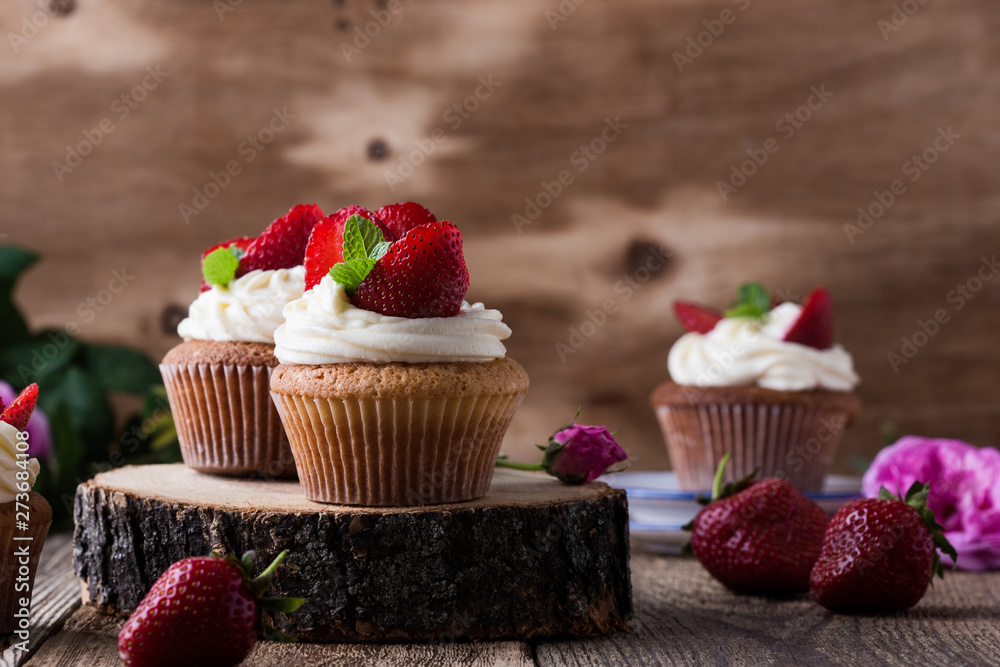 Summer dessert  cupcakes with strawberries