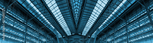Wide screen of large cargo warehouse roof. Made from steels and glasses. Adjust color theme to blue tone. 