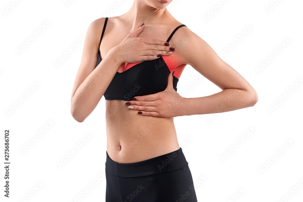 Crop female examining aching breast