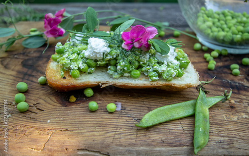 bruschetta with young cheese and green peas
