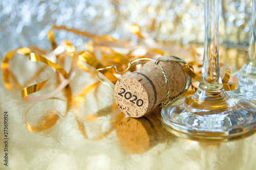 new year decorations on shining background with copy space with bow, ribbon and cork, Christmas background, Welth and health new year concept photo