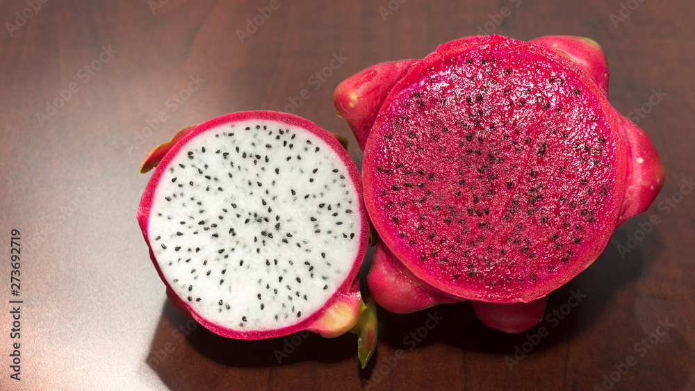 delicious dragon fruit in a cut and completely red and white delicious dragon fruit in a cut and completely red and white