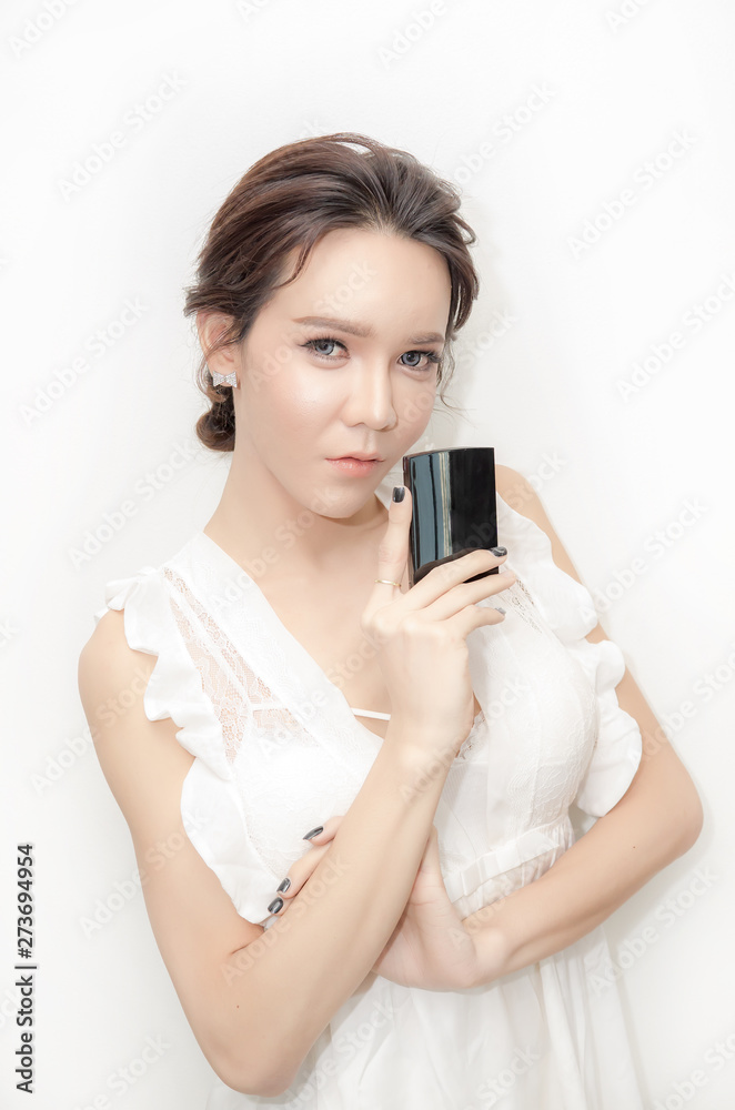 Beauty concept.Asia Cute girl holding blank box beauty on white background Beauty concept.Asia Cute girl holding blank box beauty on white background